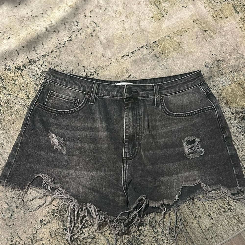 Distressed black jean shorts